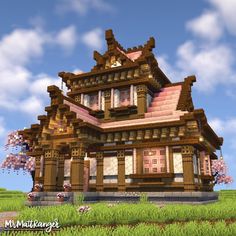 a large wooden house sitting on top of a lush green field