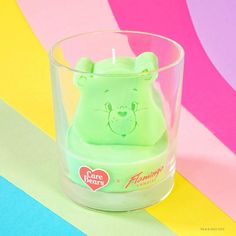 a small plastic animal in a glass cup