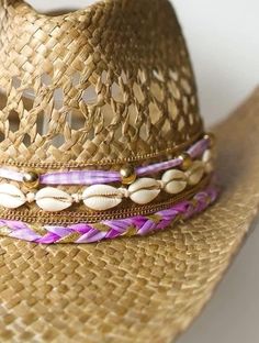 Did someone say coastal cowgirl summer??? Beach day? Country concert? Girls trip? Our handmade cowgirl hats are the PERFECT accessory for any outfit! The Kohana (or Little Flower) Hat is a tan straw cowgirl hat decorated with purple & gold ribbon, plain cowrie shells, & gold chain. Cowgirl Hat Decorated, Diy Cowgirl Hat, Coastal Cowgirl Hat, Straw Cowgirl Hat, Cowgirl Summer, Beach Hippie, Hat Aesthetic, Chapeau Cowboy, Purple Decor