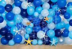 blue and white balloon decorations with starfish