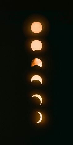 the moon is seen through several different lenses on a street light in the dark