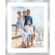 a family posing for a photo on the beach