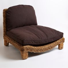 a wicker chair with brown cushion on it