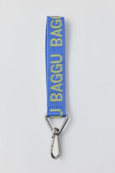 a blue and yellow bag strap with the word bagged back on it's side