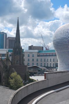 a large building with a clock tower in the background