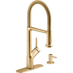 a brass faucet with two handles and nozzles on the side, is shown