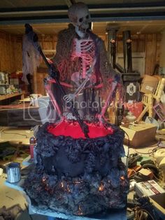 there is a fake skeleton on top of a cake