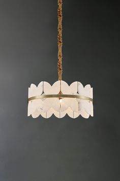 The Alabaster Petal Tier Chandelier encapsulates the peaceful beauty of a clear sky, featuring hand-crafted alabaster layers that evoke the gentle flow of clouds. The natural patterns and translucency of the alabaster interact with light, creating a subtle and welcoming ambiance. Each alabaster piece is skillfully set in a circular brass frame, infusing a hint of modernity into the ethereal composition. The end result is a timeless and contemporary chandelier that exudes elegance and provides a Tier Chandelier, Staircase Lighting, Contemporary Chandelier, Brass Lighting, Clear Sky, Lamps Ceiling, Brass Frame, Patterns In Nature, Edison Light Bulbs