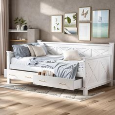 a white bed sitting on top of a wooden floor