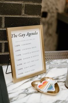 The Gay Agenda wedding sign for classic black tie gay wedding Queer Wedding Reception, His And His Wedding, Queer Wedding Ideas Decor, Wedding Signing Ideas, Lesbian Wedding Signs, Wedding Ideas Lesbian Receptions, Lgbtq Wedding Two Brides Ideas, Trans Wedding Ideas, Mlm Weddings Aesthetic