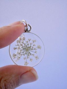 "Our Arrowhead Frame has a modern bohemian feel and is available in a variety of real preserved botanicals. Choose from 24k gold plated or .999 sterling silver plated. The Dandelion Seed symbolizes wishes. The Fern is a symbol of sincerity Forget-me-nots are known as a symbol of lasting friendship, love, and remembrance Lavender is a symbol of devotion Pendant hangs from a gold or silver plated chain, available in 26\" or 30\" lengths. Choose from plain chain or satellite chain, see picture for Nature-inspired Necklace With Flower Charm, Delicate Jewelry With Flower Charm Pendant, Nature-inspired Flower Jewelry As A Gift For Her, White Round Pendant Jewelry With Flower Charm, Nature-inspired Flower Pendant Jewelry As Gift, Nature-inspired Flower Pendant Jewelry For Gifts, White Flower Charm Round Pendant Jewelry, Nature-inspired Jewelry With Flower Charm, Nature-inspired Jewelry With Flower Charm For Anniversary