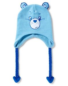 Stay warm, cozy, and cute with this Grumpy Care Bear laplander hat! This fun and attention-getting hat is perfect for any Care Bears fan! Officially licensed Adjustable Relaxed fit Material: Polyester Care: Spot clean Imported Care Bear Accessories, Playful Hats For Cold Weather, Playful Cotton Winter Hat, Playful Warm Cotton Hat, Warm Cotton Playful Hat, Warm Playful Cotton Hat, Warm Adjustable Hats For Playtime, Casual Beanie For Playtime, Playful Warm Hat For Playtime