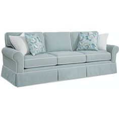 a light blue couch with pillows on it