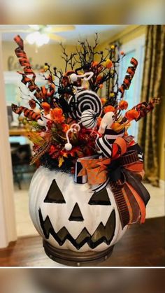 a pumpkin decorated with candy and halloween decorations