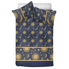 a blue and yellow bed set with sun, moon and stars on the night sky