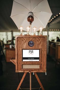 an umbrella on top of a wooden stand