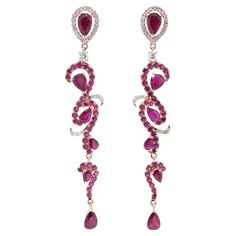 These exquisite Ruby Drop Dangle Earrings are a true statement of luxury and grace. The intricate design, set in 18k rose gold, features a brilliant combination of 84 sparkling diamonds and 54 vibrant rubies, making them the perfect blend of elegance and boldness. Elevate your style with these earrings that capture attention effortlessly. Earring Information Diamond Type : Natural Diamond Metal : 18k Metal Color : Rose Gold Number of Diamonds : 84 Number of Rubies : 54 Total Gold Weight : 6.96 g Pink Diamond Bridal Earrings, Red Diamond Accented Jewelry For Evening, Red Diamond Earrings For Party, Red Diamond Party Earrings, Elegant Ruby Bridal Earrings For Party, Elegant Rose Red Earrings For Party, Elegant Rose Red Dangle Jewelry, Jewelry Ruby, Gold Number