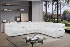 a large white leather sectional sofa in a living room