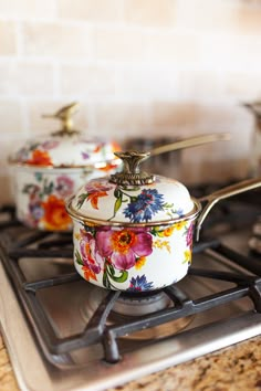 the pots are sitting on the stove top