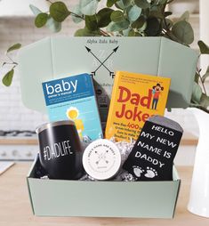 a baby gift box filled with books and personalized items for a new mom or dad