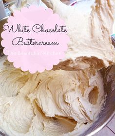 white chocolate buttercream in a metal bowl with a pink sign over it that says, white chocolate buttercream