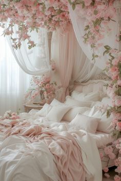 a bed covered in pink flowers and white sheets