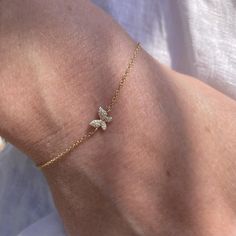 The butterfly is a sweet reminder of the beauty in transformation. This bracelet features a 6mm pave diamond butterfly on a gold chain with a lobster clasp closure. 14k yellow gold 26 round sparkling diamonds 0.05 tcw Can be worn anywhere between 6-7" Minimal Gold Bracelet Design, Simple Gold Accessories, Elegant Butterfly Jewelry With Delicate Chain, Cute Gold Bracelets, Butterfly Jewelry Aesthetic, Butterfly Jwellary, Cute Gold Butterfly Jewelry, Minimalist Yellow Gold Butterfly Jewelry, Bracelets Gold Simple For Women