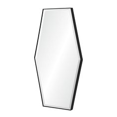 a black and white hexagonal mirror on a wall