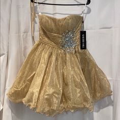 Absolutely Stunning Strapless Pleated Empire Waist Gold Sherri Hill Dress Size 8 Comes With Straps That Can Be Sewn On If Desired Gold A-line Evening Dress For Cocktail, Gold A-line Evening Dress For Cocktail Events, Gold A-line Cocktail Evening Dress, Evening Mini Dress With Fitted Bodice In Gold, Strapless Champagne Dress For Party Season, Gold Mini Dress With Fitted Bodice For Evening, Gold Sweetheart Neckline Dress For Party Season, Gold Sweetheart Neckline Party Dress, Gold Strapless Dress With Fitted Bodice