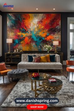 a living room filled with furniture and a large painting on the wall