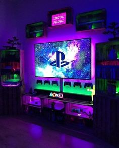 a room with purple lighting and a large screen tv on it's wall,