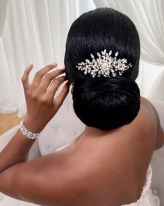 a woman wearing a bridal hair comb