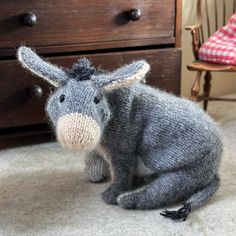 a stuffed animal is sitting on the floor