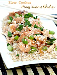 a white plate topped with rice and meat