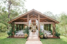 an outdoor wedding venue with chairs and tables