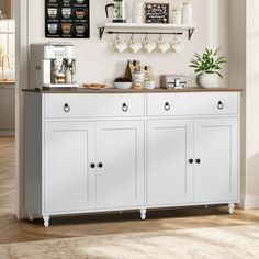 a kitchen with white cupboards and shelves filled with coffee items on top of them