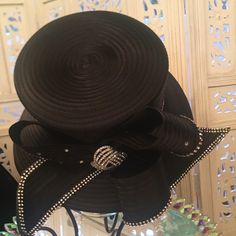 Perfect For Any Occasion, Especially Opening Day At The Races. Classy And Elegant. 100% Polyester. The Special Details Of The Rhinestones And The Ribbon Like Design Make It A Must Have In Your Hat Collection. It Can Be Adjusted To Your Size. Elegant Black Adjustable Hat, Elegant Embellished Hats For Formal Occasions, Elegant Embellished Formal Hats, Black Evening Hat With Rhinestones, Black Evening Hats With Rhinestones, Elegant Evening Hats With Rhinestones, Black Hat With Rhinestones For Evening, Adjustable Black Hats With Rhinestones, Adjustable Black Hat With Rhinestones