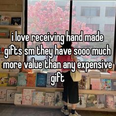 a person standing in front of a window with the words i love receiving hand made gifts sm