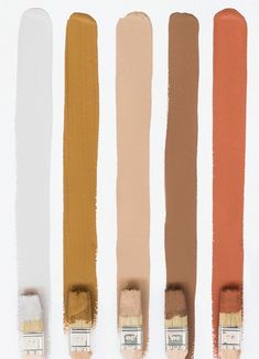 four different shades of brown, tan, and white paint with the same brush in each