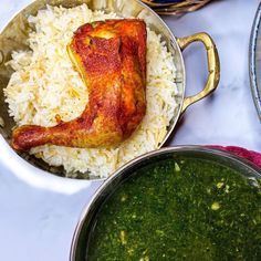 two pans filled with rice and meat next to each other on top of a table