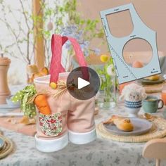 a table topped with lots of different types of food and vases filled with flowers