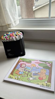 there is a coloring book and some crayons on the table