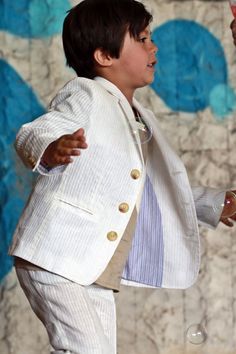 "Summer linen jacket with lapel for boys, stylish wedding outfit. This ring bearer kids wedding blazer has contrast cover stitches and trendy sleeve darts. Your boy will look sharp in this summer linen jacket from For Cuties Kids. The low thread count and breathability of this luxurious material will keep your boy feeling cool and comfortable as the temperature rises. Boys 100% linen blazer. The casual white blazer is fully lined and features a single breast design with button up front, two side Summer Linen Blazer, Boys Blazer, Wedding Blazer, Beach Wedding Suits, Ring Bearer Boy, Wedding Outfit For Boys, White Linen Suit, Seersucker Suit, Summer Blazer