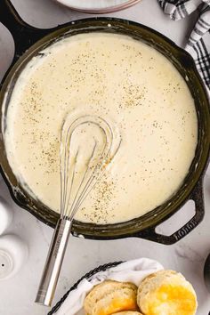 a pan filled with batter next to some cookies