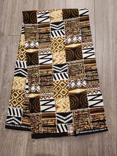 DESCRIPTION African Ankara Fabric. This is high quality African print is 100% cotton and it's 45 inches wide. It is used for making African Clothing, African quilts, & For Home decoration. FYI: Print is Double sided. The listing is for 3yards and 6yards Each piece of fabric measures: 105 - 108in by 45in for 3yards 210 - 216in by 45in for 6yards If you purchase more than one yard, you will receive one continuous piece. *If you require more than what I have listed, feel free to send me email. CARE Traditional Batik Print Fabric, Traditional Black Fabric With Block Print, Traditional Black Block Print Fabric, Traditional Brown Ankara Fabric, Traditional Ankara Fabric With Pattern Prints, Black Ankara Fabric With Traditional Patterns, Traditional Brown Cotton Fabric, African Quilts, Clean And Press