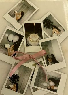 several polaroid photos with pink ribbon and balloons in the background on a white surface