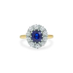 an oval sapphire and diamond cluster ring