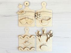 three wooden christmas ornaments on a white table with one cut out and the other made from wood