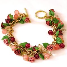 Handmade Pink Flower Bracelet With Gold Toned Chain. Shades Of Pink Beads. Porcelain Jewelry Made By Me From Air Dry Porcelain Clay. Each Pedal Is Molded By Hand To Form The Flowers And Leaves. Please Note That Colors Could Vary Slightly Due To Lighting. Approximate Measurement Size 8.25" Condition: New Never Worn Offers Welcome Cottage Core Jewelry Diy, Pink Flower Charm Bracelet For Jewelry Making, Adjustable Pink Jewelry With Handmade Flowers, Handmade Pink Polymer Clay Bracelets, Pink Bracelets With Flower Decoration As Gift, Pink Bracelets With Flower Decoration For Gift, Pink Flower Decorated Bracelet Gift, Pink Flower Decoration Bracelet As Gift, Handmade Pink Polymer Clay Beaded Bracelets