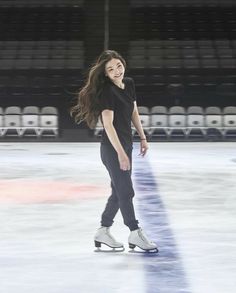 a young woman skating on an ice rink